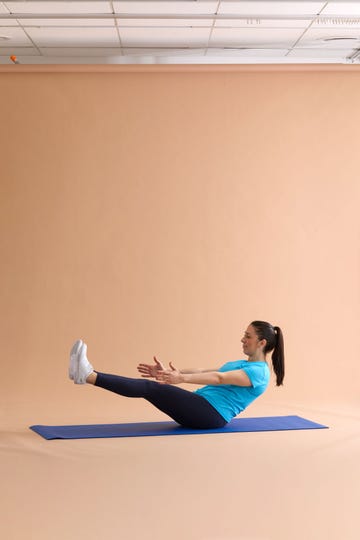 A person performing an exercise on a yoga mat