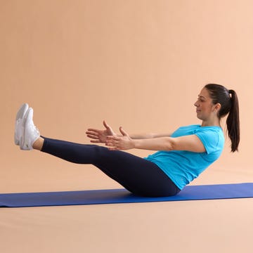GHK A person performing an exercise on a yoga mat