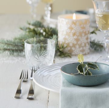 Holly and place setting on Christmas table