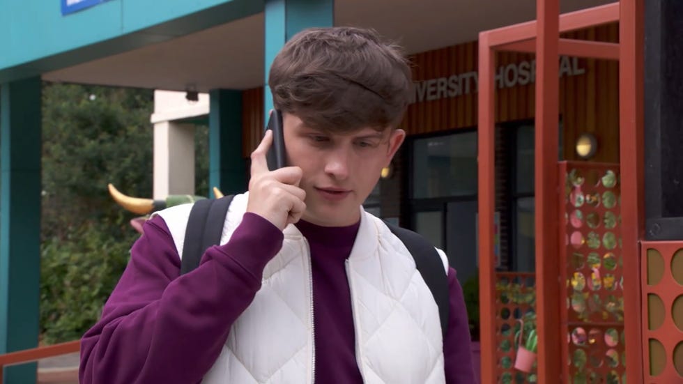 hollyoaks charlie dean on the phone outside a hospital