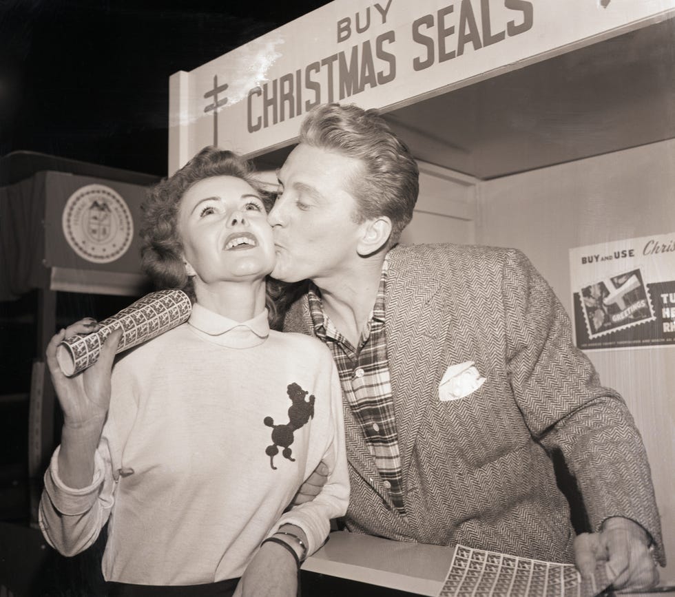 Kirk Douglas Kissing a Seal Customer