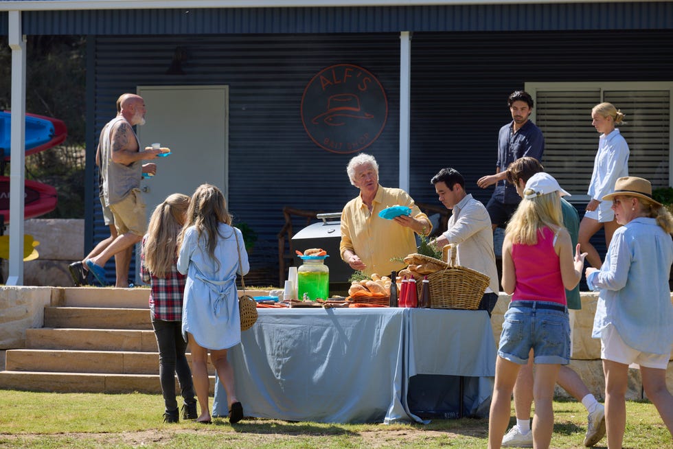 john palmer and justin morgan at the new bait shop opening in home and away