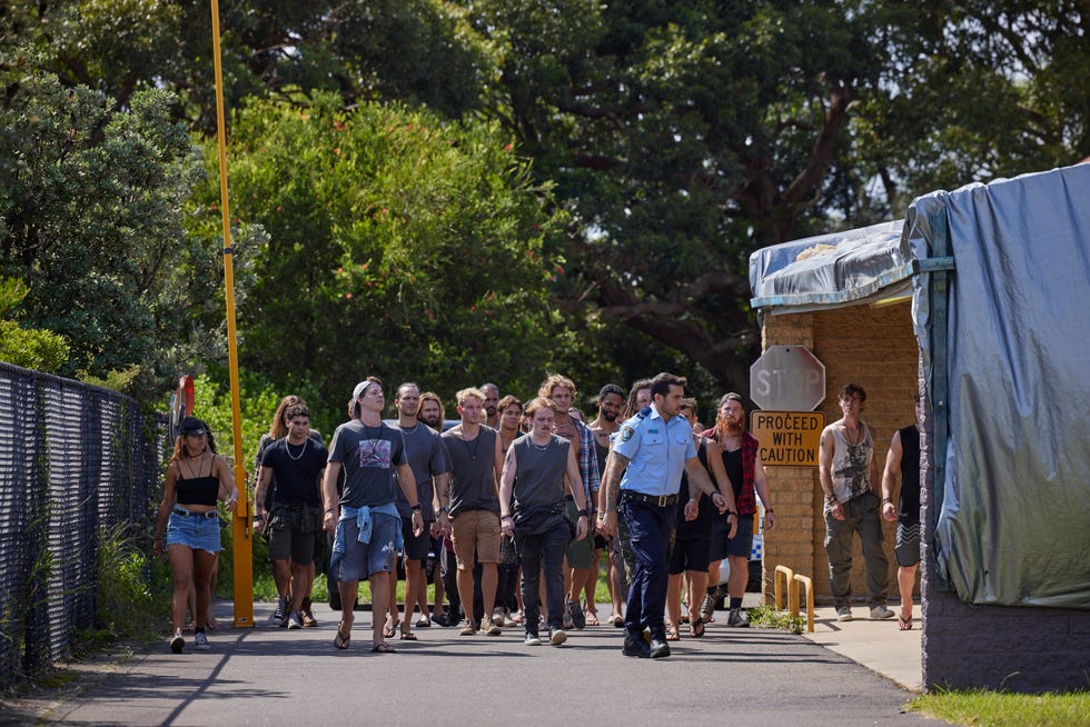 Cash Newman is surrounded by River Boys in Home and Away cash newman is surrounded by river boys in home and away