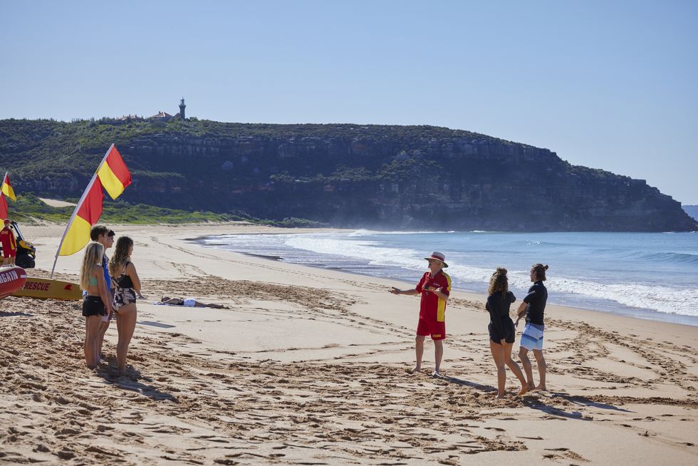 john palmer leads a beach class in home and away
