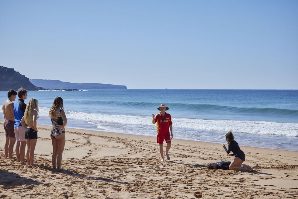 john palmer leads a beach class in home and away