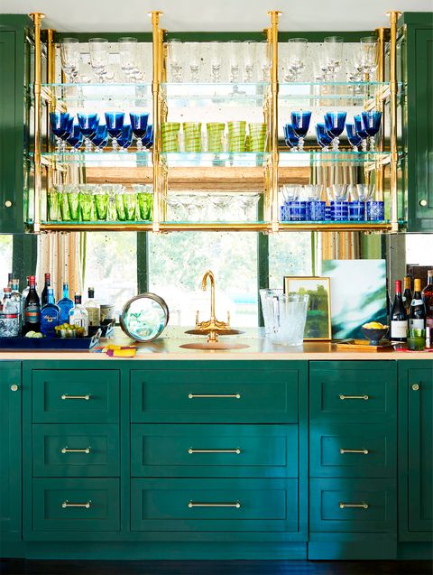 home bar with green cabinets