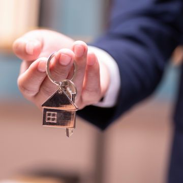 home concept,businessmen holding home keys