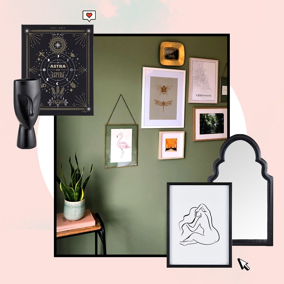 various picture frames hanging on a dark green wall
