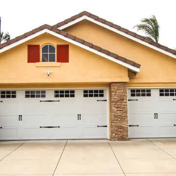 home exterior with carriage style garage doors