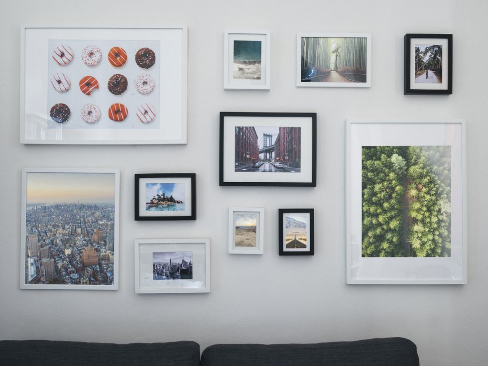 home interior with sofa and paintings on the wall