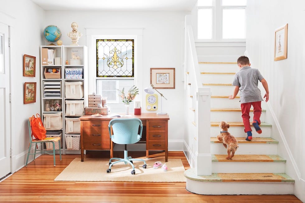 entryway with a home office tucked beside the stairs