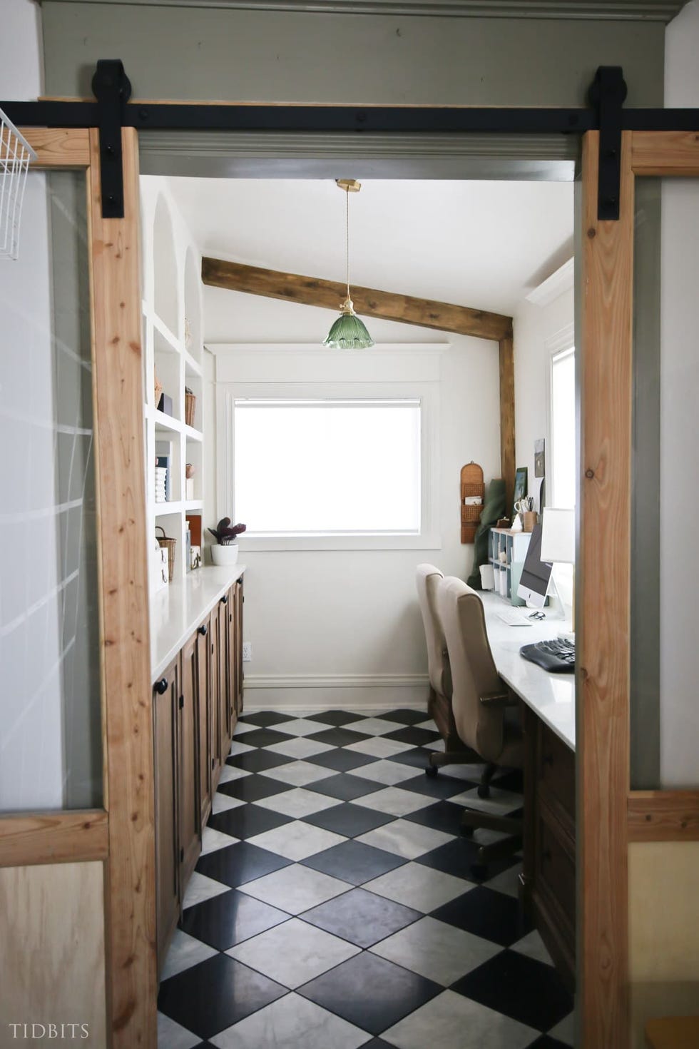 home office space with wood accents and checkered flooring