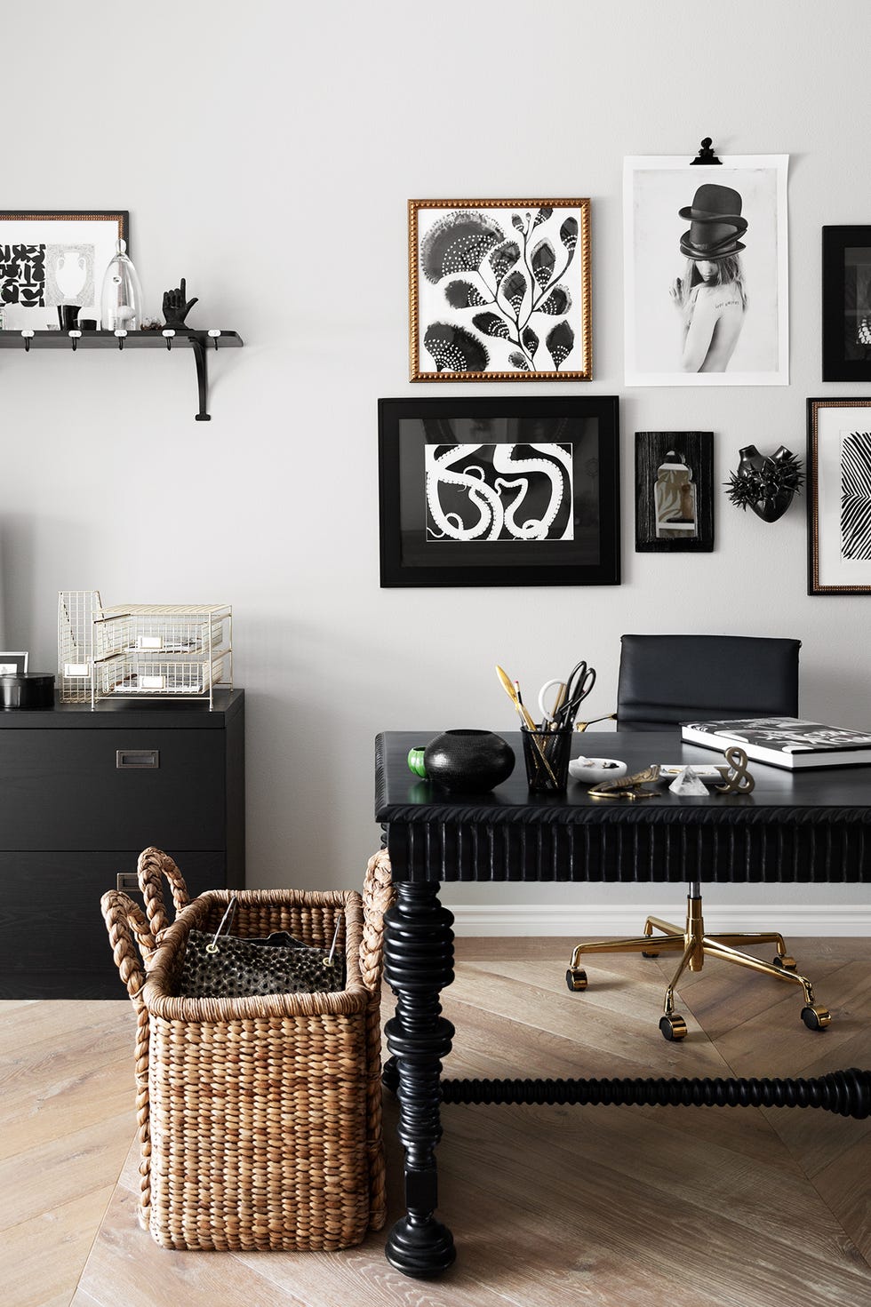 black and white home office with gallery wall