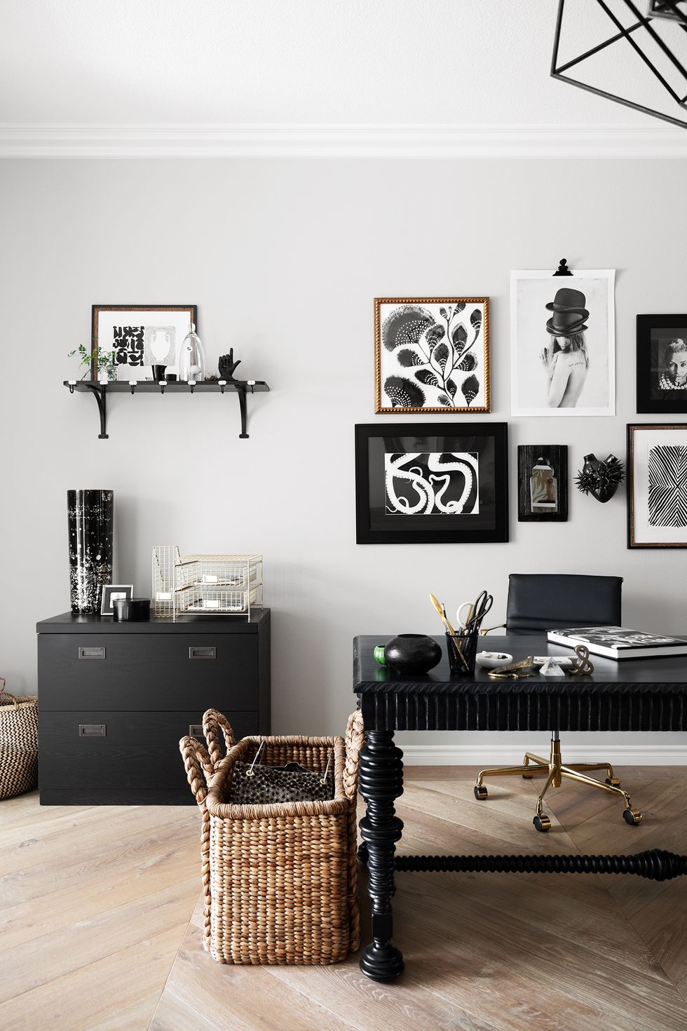 black and white home office with gallery wall