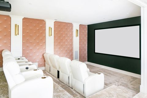 pink upholstered walls in home theater