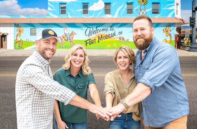 dave and jenny marrs, erin and ben napier, home town takeover stars, gathered around for a hand stack