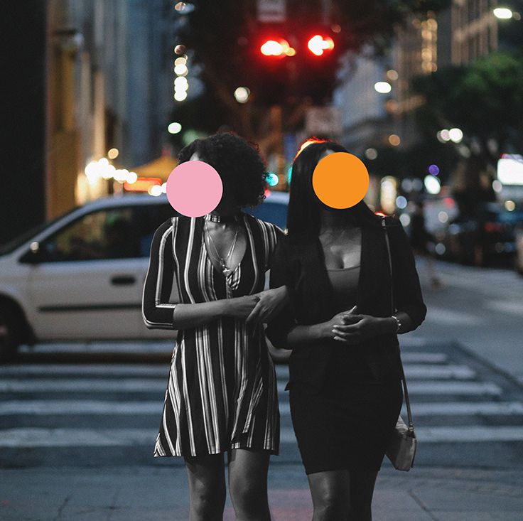 street style portrait of two young, fashionably dressed mixed race latina women on the streets of downtown los angeles, just having a walk of maybe going out for a dinner together