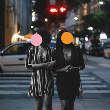 street style portrait of two young, fashionably dressed mixed race latina women on the streets of downtown los angeles, just having a walk of maybe going out for a dinner together