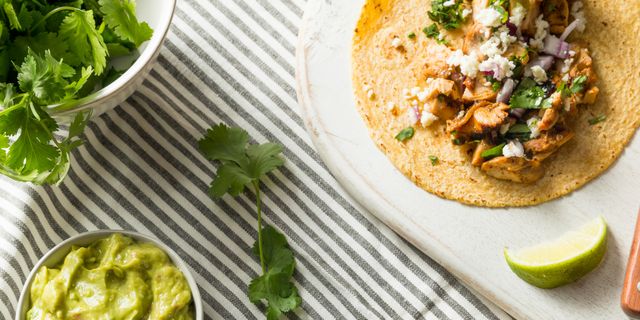 https://hips.hearstapps.com/hmg-prod/images/homemade-chicken-tacos-with-onion-royalty-free-image-1584644178.jpg?crop=1.00xw:0.334xh;0,0.440xh&resize=640:*