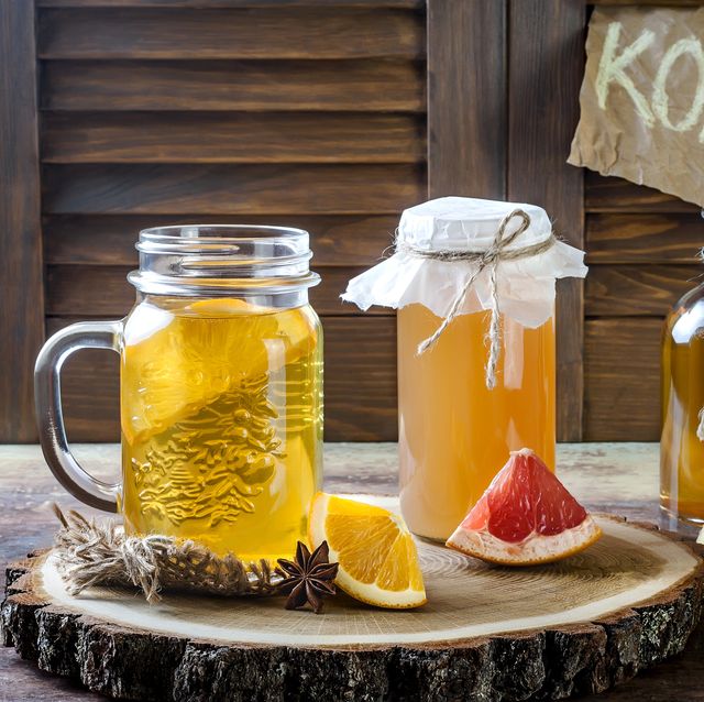 Homemade fermented raw kombucha tea with different flavorings. Healthy natural probiotic flavored drink.