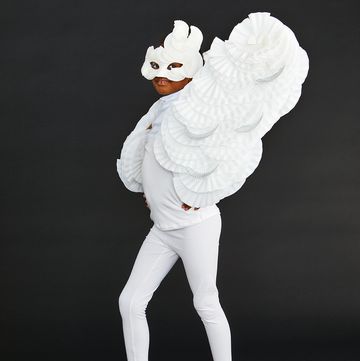 homemade halloween costumes, small girl wearing a white shirt, white leggings, a white mask and diy white wings