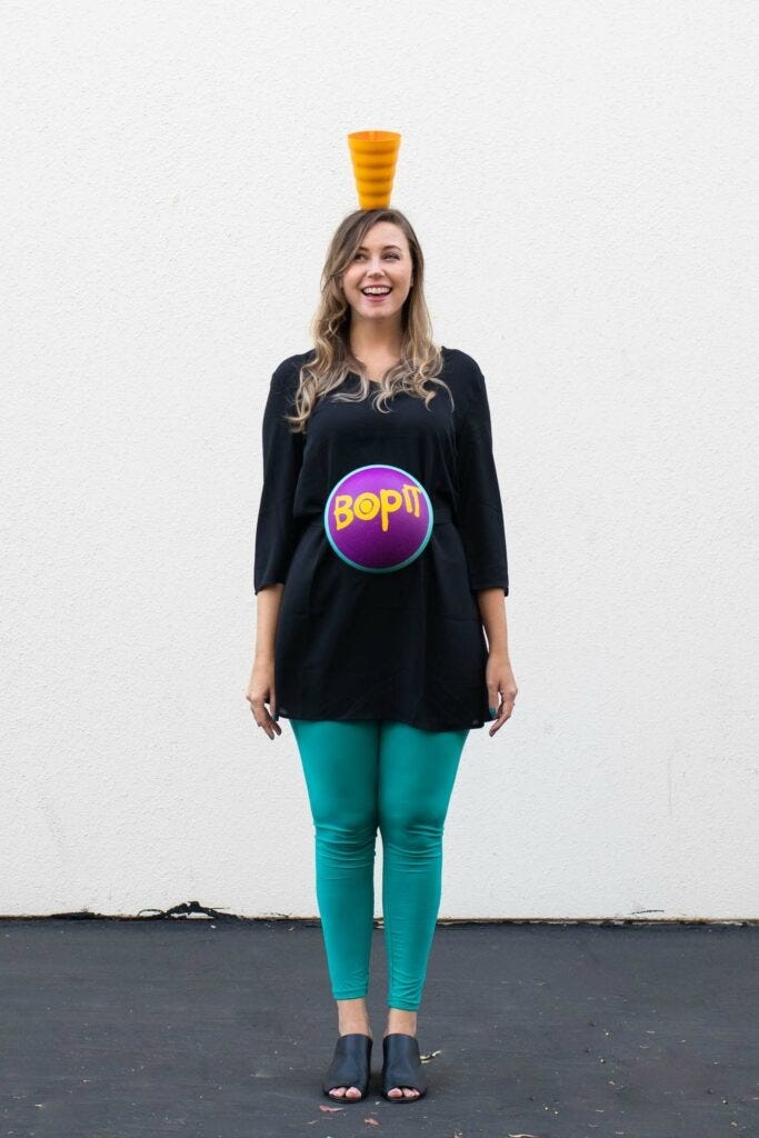 homemade halloween costumes, woman wearing green leggings and a black shirt
