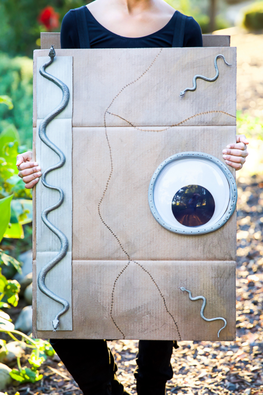 homemade halloween costumes spell book homemade halloween costumes, child holding a diy spellbook