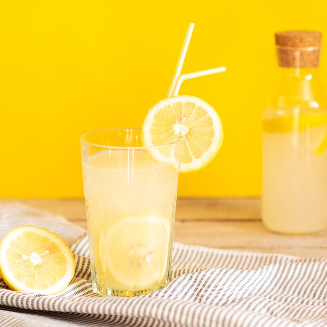 homemade lemonade in mason jars with big green paper straw