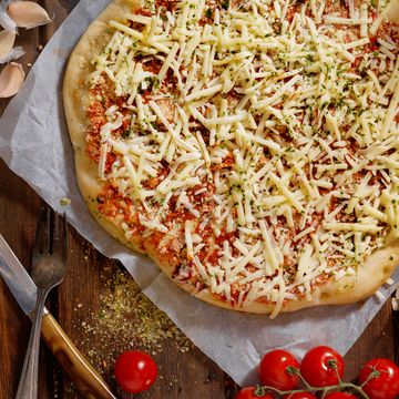 homemade pizza with shredded cheese