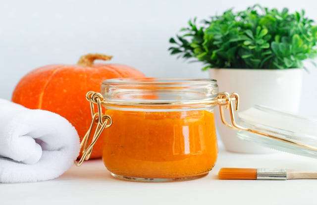 homemade pumpkin face mask in a glass jar diy cosmetics and spa recipe copy space