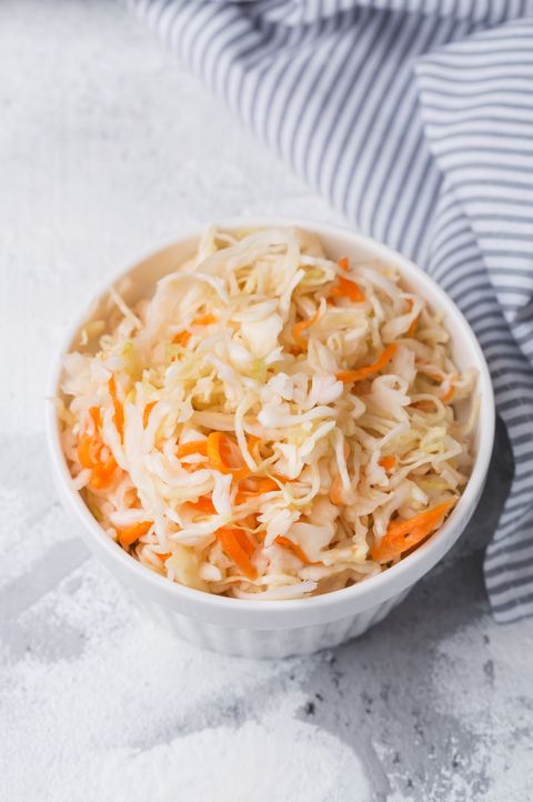 homemade sauerkraut in a plate, fermented cabbage in a bowl