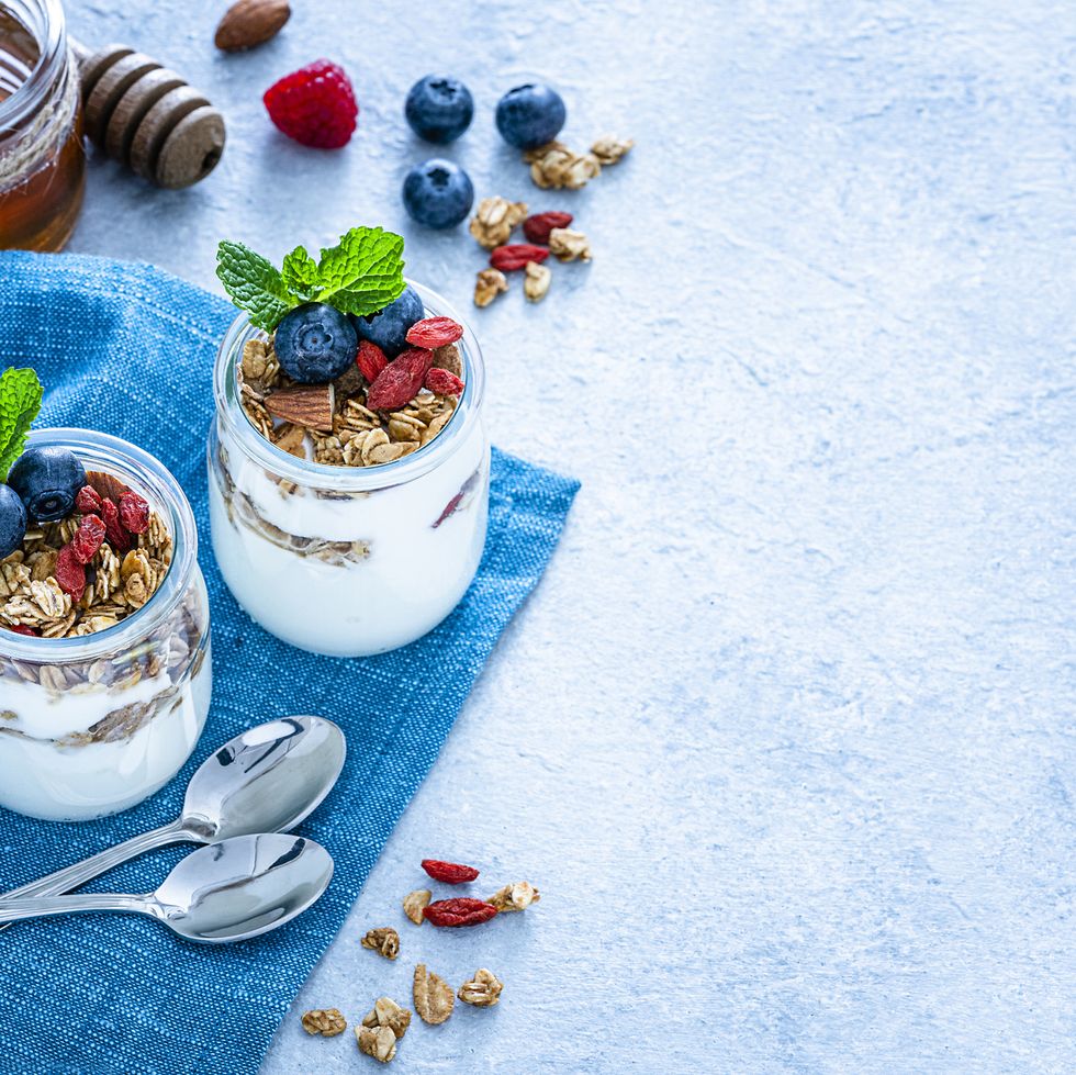 homemade yogurt and granola on blue table