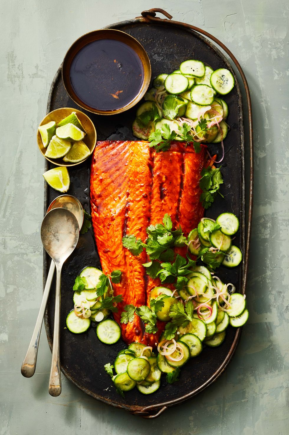 glazed salmon with sliced cucumbers on the side
