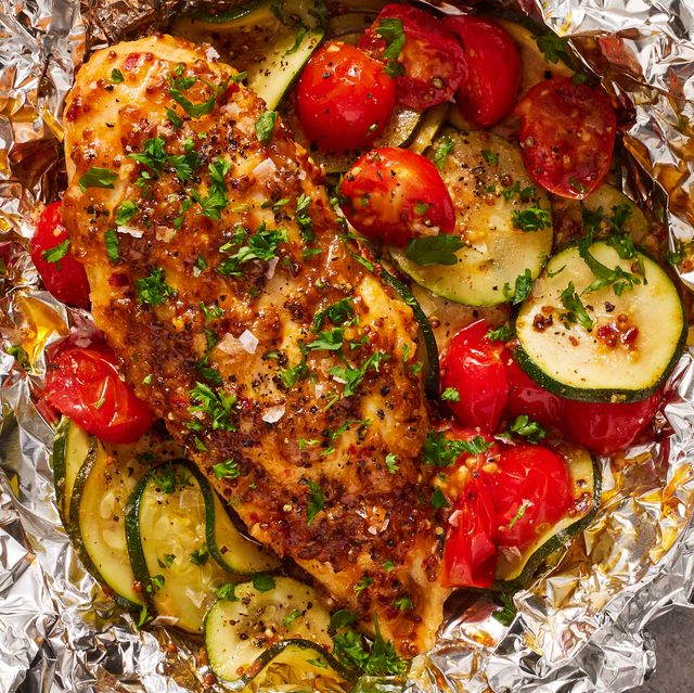 https://hips.hearstapps.com/hmg-prod/images/honey-mustard-chicken-and-vegetable-foil-packets-1672781524.jpg?crop=0.681xw:1.00xh;0.160xw,0&resize=640:*