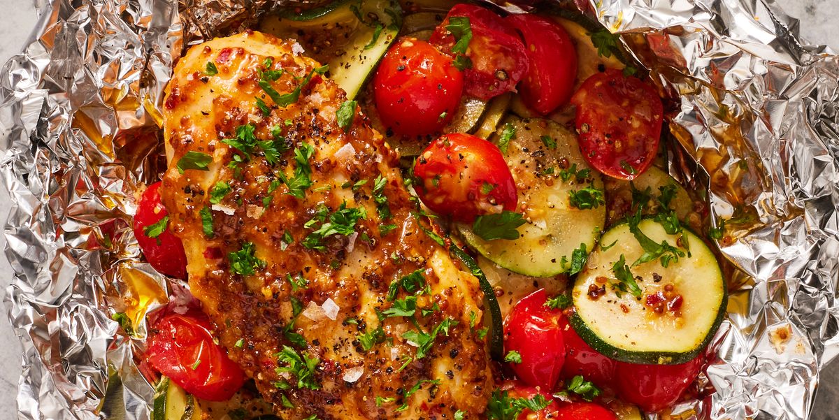 https://hips.hearstapps.com/hmg-prod/images/honey-mustard-chicken-and-vegetable-foil-packets-1672781524.jpg?crop=0.910xw:0.670xh;0.0417xw,0.137xh&resize=1200:*