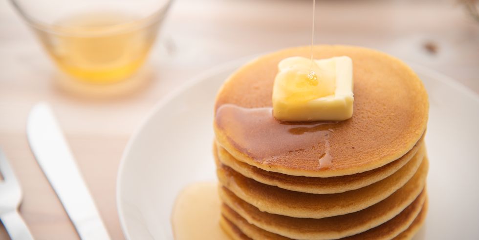 honey toppings on overlapping pancakes