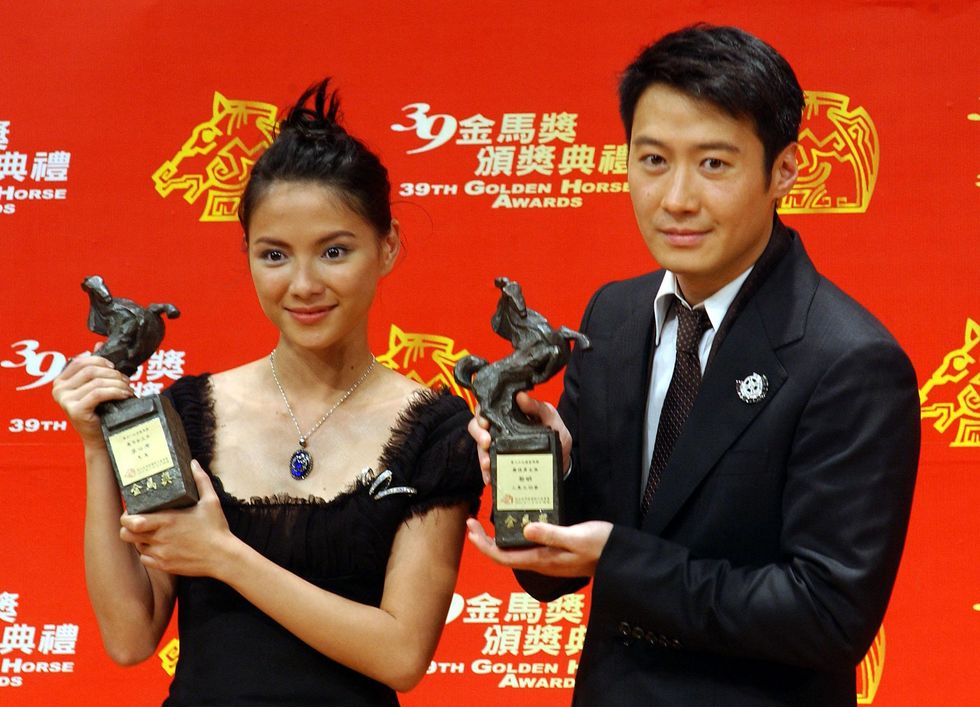 Hong Kong actor Leon Lai (R) and Malaysian actress