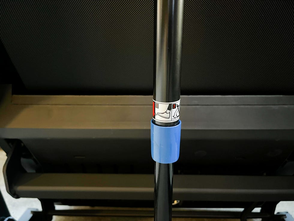 Adjustable pole with instructional graphics for usage