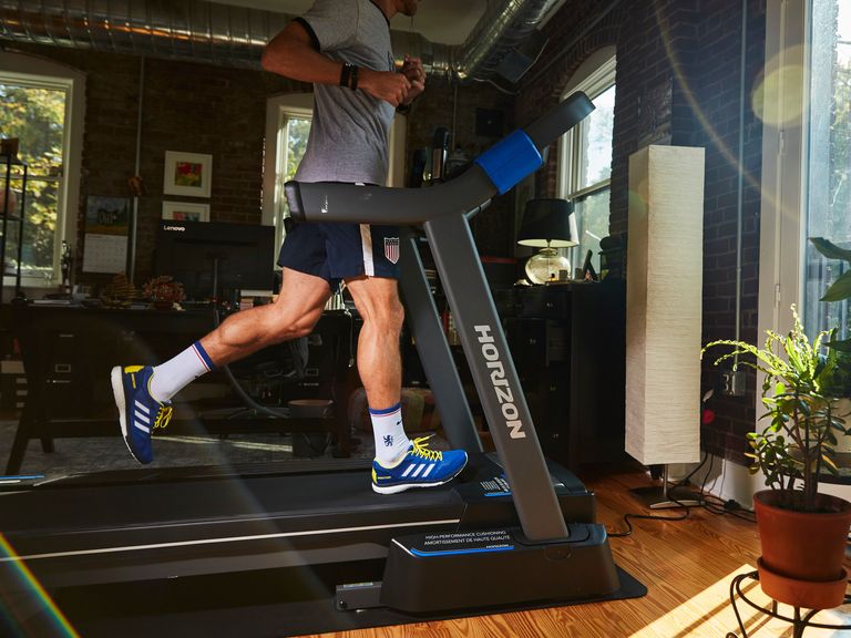 running in living room on horizon folding treadmill