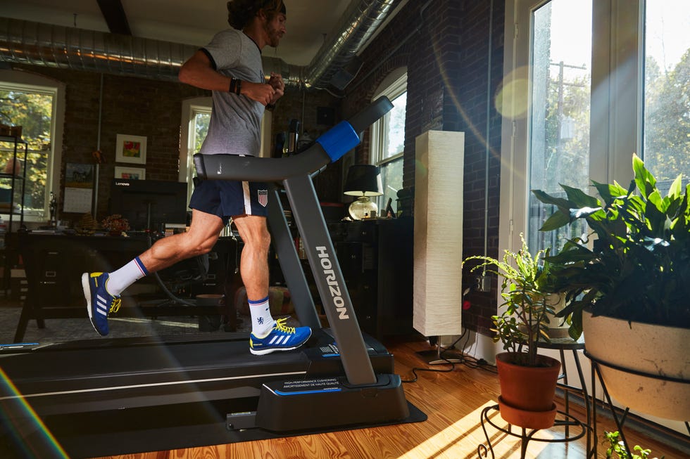 running in living room on horizon folding treadmill