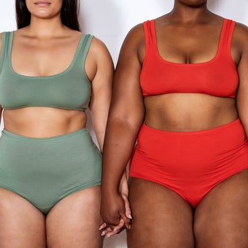 Plus size women in lingerie standing together holding hands cropped shot of a three multi ethnic females of different sizes in lingerie on white background. group of plus size women in lingerie standing together holding hands.