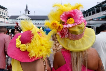 kentucky derby fans wearing bright pink and yellow hats