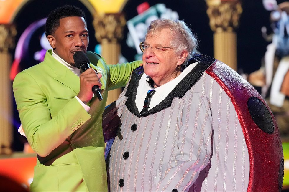 jerry springer embracing host nick cannon on stage
