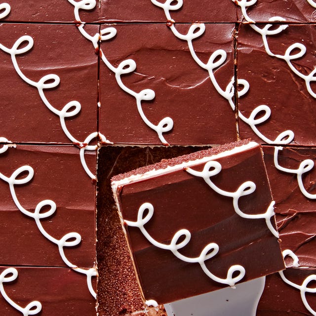 chocolate sheet cake with white piped icing