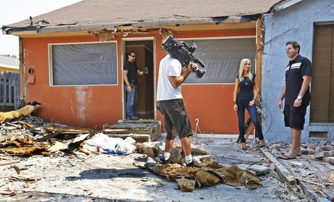 TV hosts Tarek El Moussa , right, and his wife Christina El Moussa, second from right, talk during