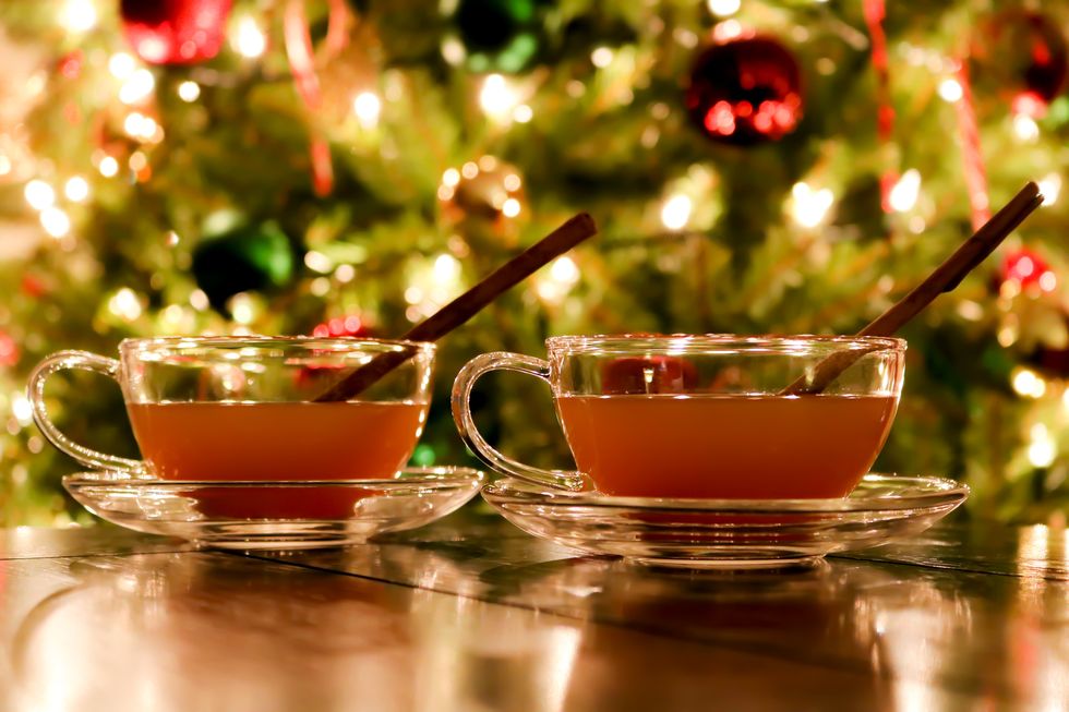 hot apple cider by the christmas tree