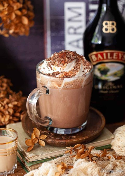 baileys hot chocolate with whipped cream in glass mug