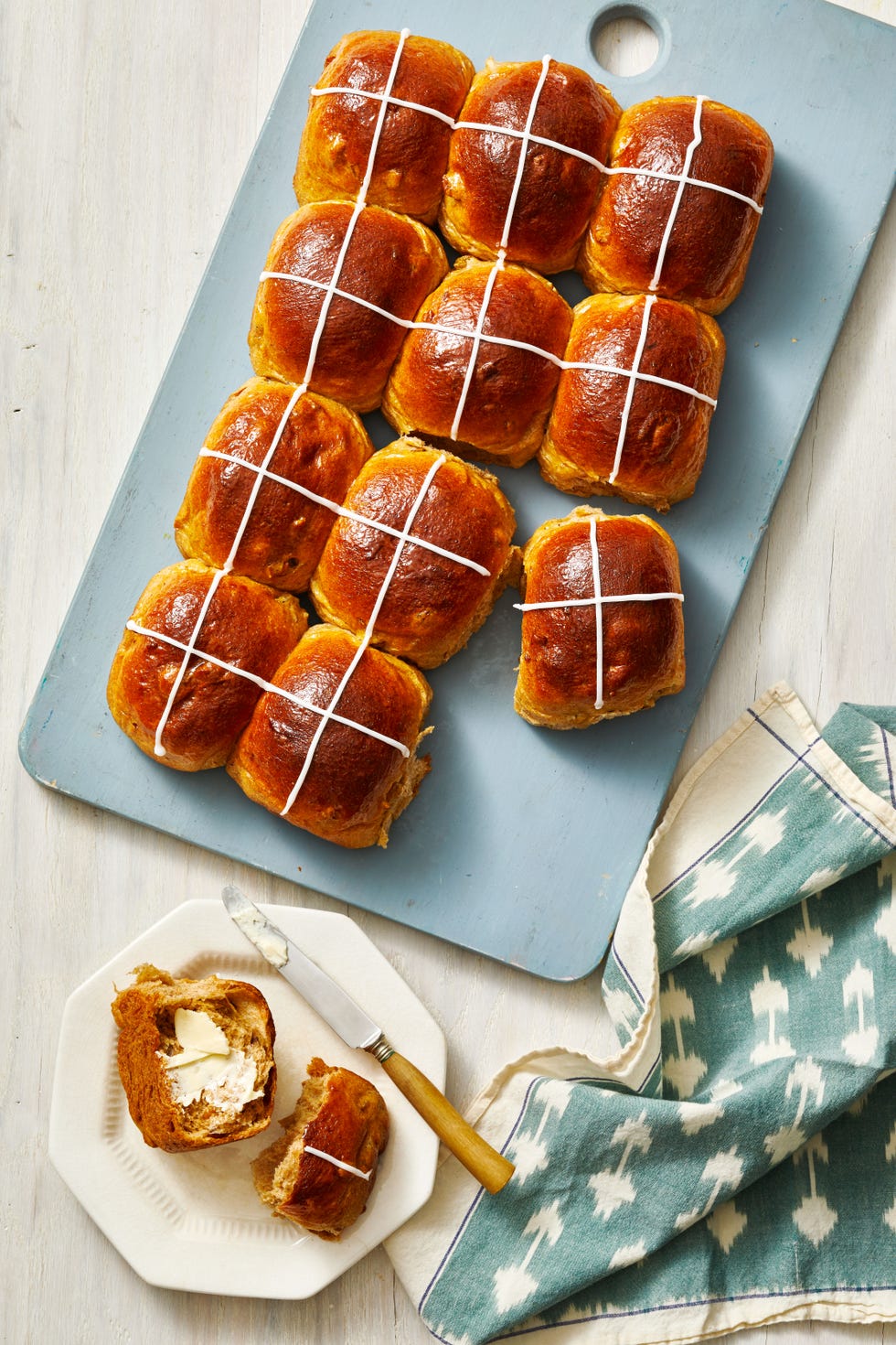 hot cross buns on a blue board