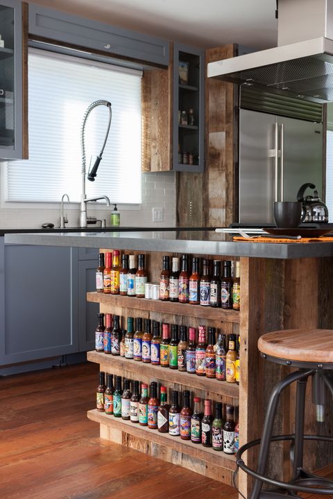 An upcycled kitchen designed around a hot sauce shelf by Dirty Girl Construction