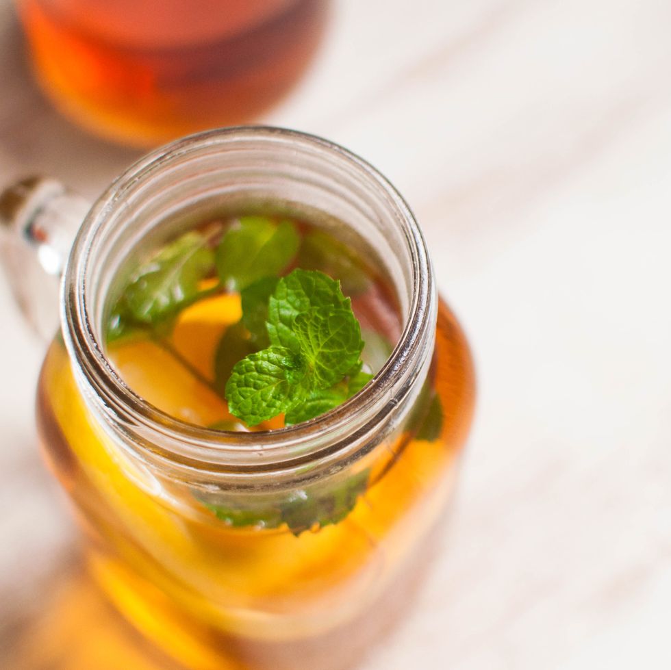 hot tea with lemon and mint leaves